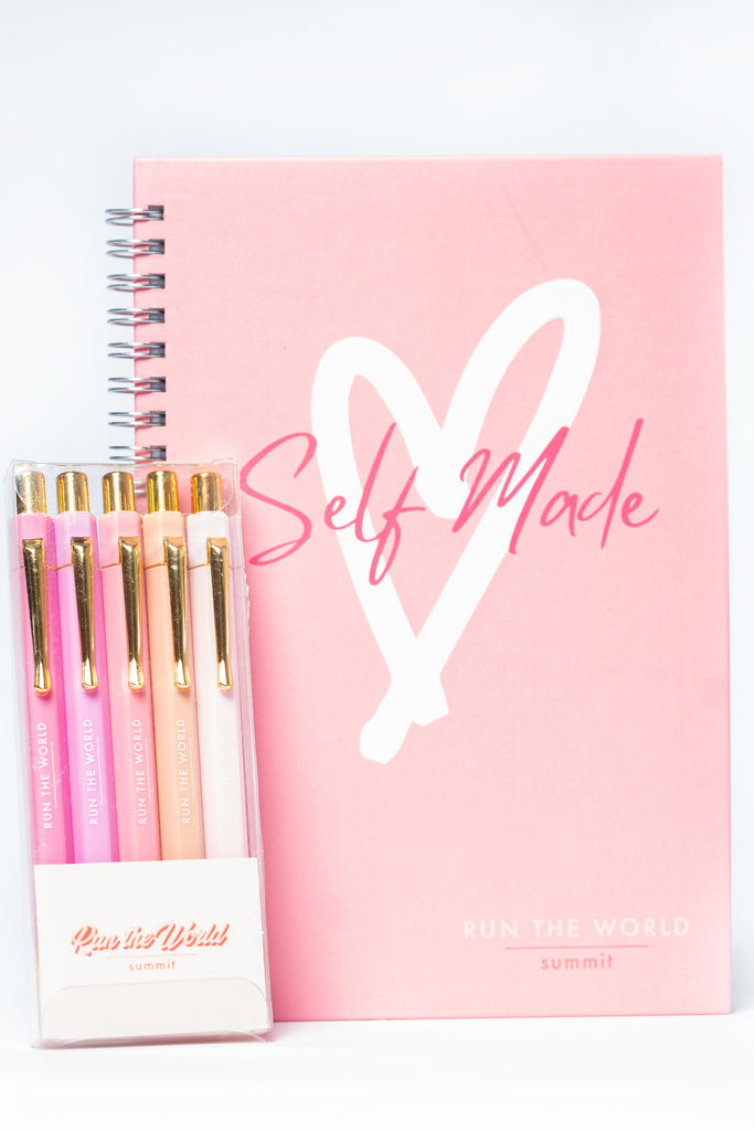Run the World Self Made Summit planner in pink with assorted pens